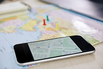 Closeup of smartphone with GPS application Closeup of smartphone with GPS application