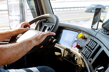 Truck drivers big truck driver's hands on big truck steering wheel